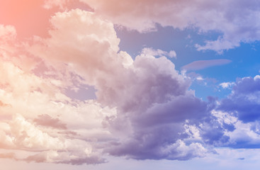 White clouds with blue sky background. Color toned image.