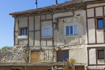 old town house with broken walls and modern windows