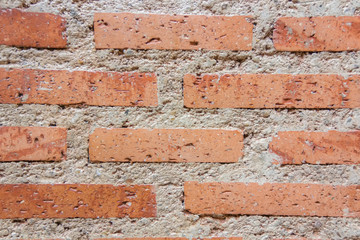 Background of red bricks wall with cement