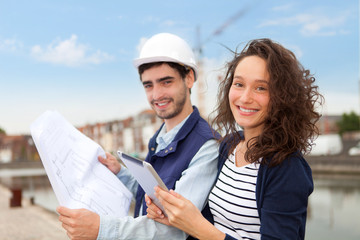 Architect woman and construction site supervisor