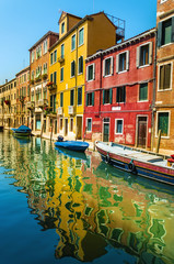 Fototapeta na wymiar Venetian scenery, colorful houses on the canal, Venice, Italy