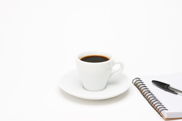Cup of coffee with notebook
