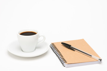 Cup of coffee with notebook