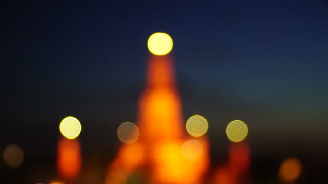 Twilight time of Wat Arun across Chao Phraya River during sunset
