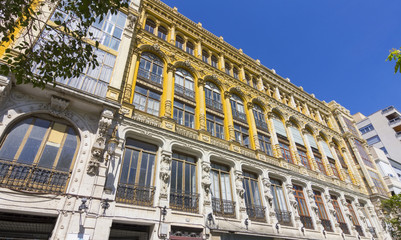 nice old building with highly decorated facade and large windows