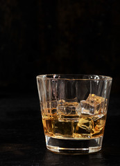 Iced bourbon in a glass tumbler