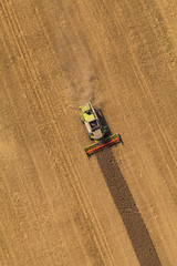 aerial view of combine on harvest field