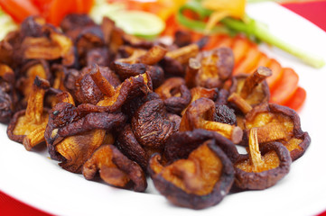 close up chinese food from mushroom fried in white dish