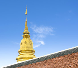 Fototapeta premium the golden pagoda in Thailand temple with blue sky