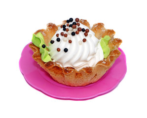 Cake basket with white cream decorated with small balls