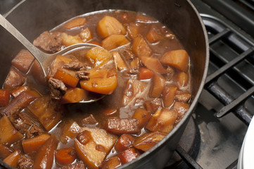 Delicious beef stew cooking in a pot