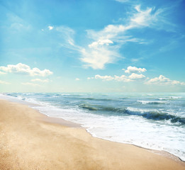 Fototapeta na wymiar Yellow sand beach and blue sky and sea