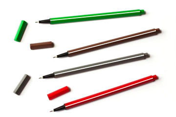 Fototapeta premium Colorful pens on white background