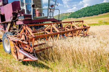 close-up of wheat harvesting machinery. Agricultural activities