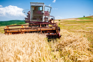 industrial harvesting combine harvesting wheat