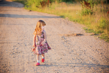 happy little girl on road