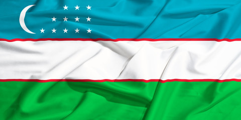Uzbekistan flag on a silk drape waving