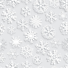 Seamless pattern of paper snowflakes on gray