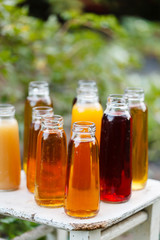 Fototapeta na wymiar different bottles of juice