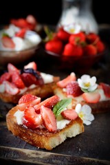 strawberries sandwiches with cream cheese and mint closeup