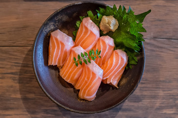 Fresh salmon sashimi in a bowl