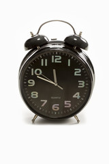 glossy alarm clock against white background