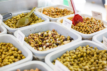 Different marinated olives on provencal street market in Provenc
