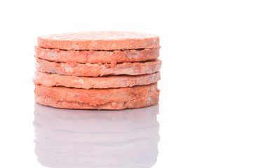 Frozen raw hamburger beef meat over white background