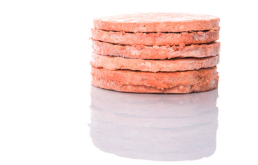 Frozen raw hamburger beef meat over white background