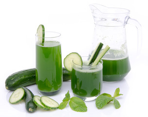 Composition with two glasses and a jug of cucumber juice, fresh