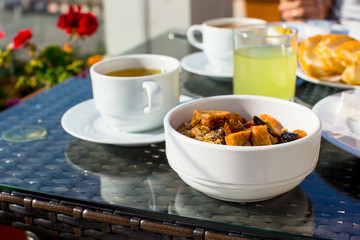 Tasty breakfast with flakes,dried fruit and cup of tea