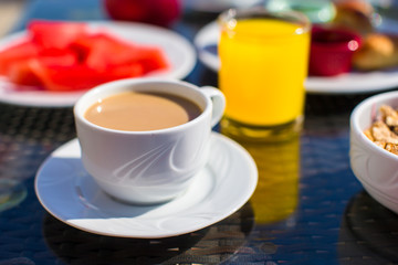 Cacao, juice and fruits for breakfast at a cafe in the resort