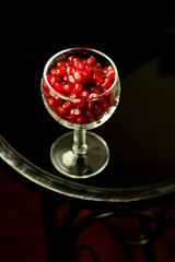 pomegranate seeds on black