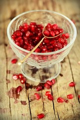 Juicy pomegranates on wood