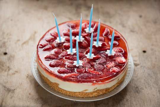 Birthday cake with strawberries and candles