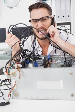 Angry computer engineer making a call