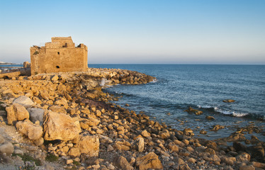 Fototapeta na wymiar castle near sea during sunset