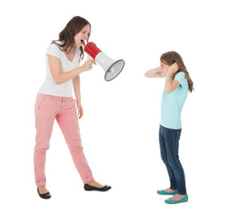 Angry Mother Shouting Through Megaphone At Daughter