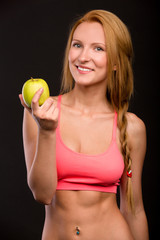 beautiful smiling girl with apple  in hand