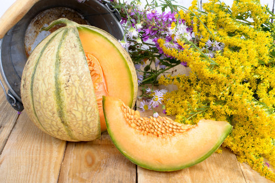melon with a bouquet of yellow flowers