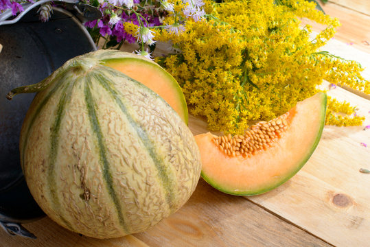 melon with a bouquet of yellow flowers
