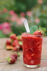 Strawberry smoothie in glass, toned
