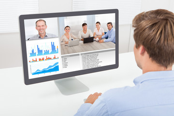 Businessman Video Conferencing On Computer