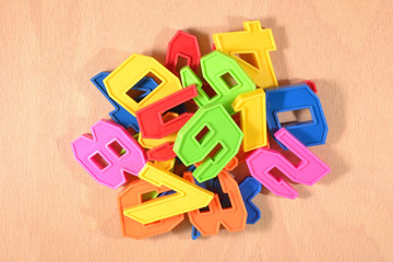 Heap of plastic colored numbers