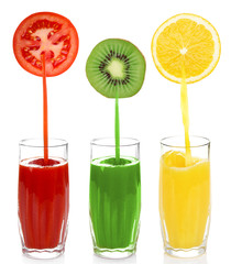 Juice pouring from fruits and vegetables into glass, isolated