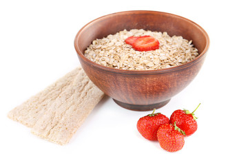 Big brown bowl with oatmeal and berries