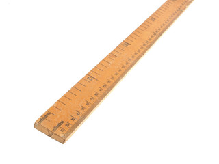 Close up photo of a wooden meteric ruler on a white dackground