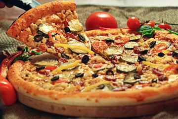 pizza with a slice cut, delicious pastries