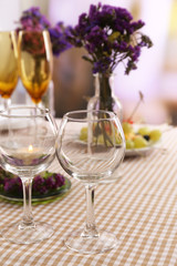 Buffet table with dishware waiting for guests