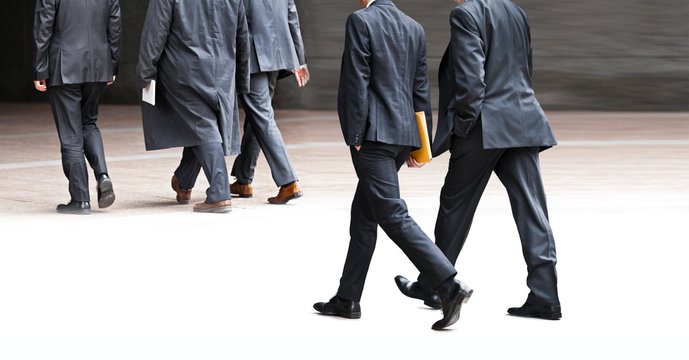 Businessmen walking on the street.